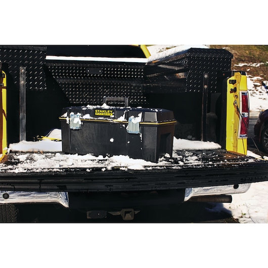 24 inch Series 2000 Tool Box with Tray placed in cargo bed of a truck covered with snow.