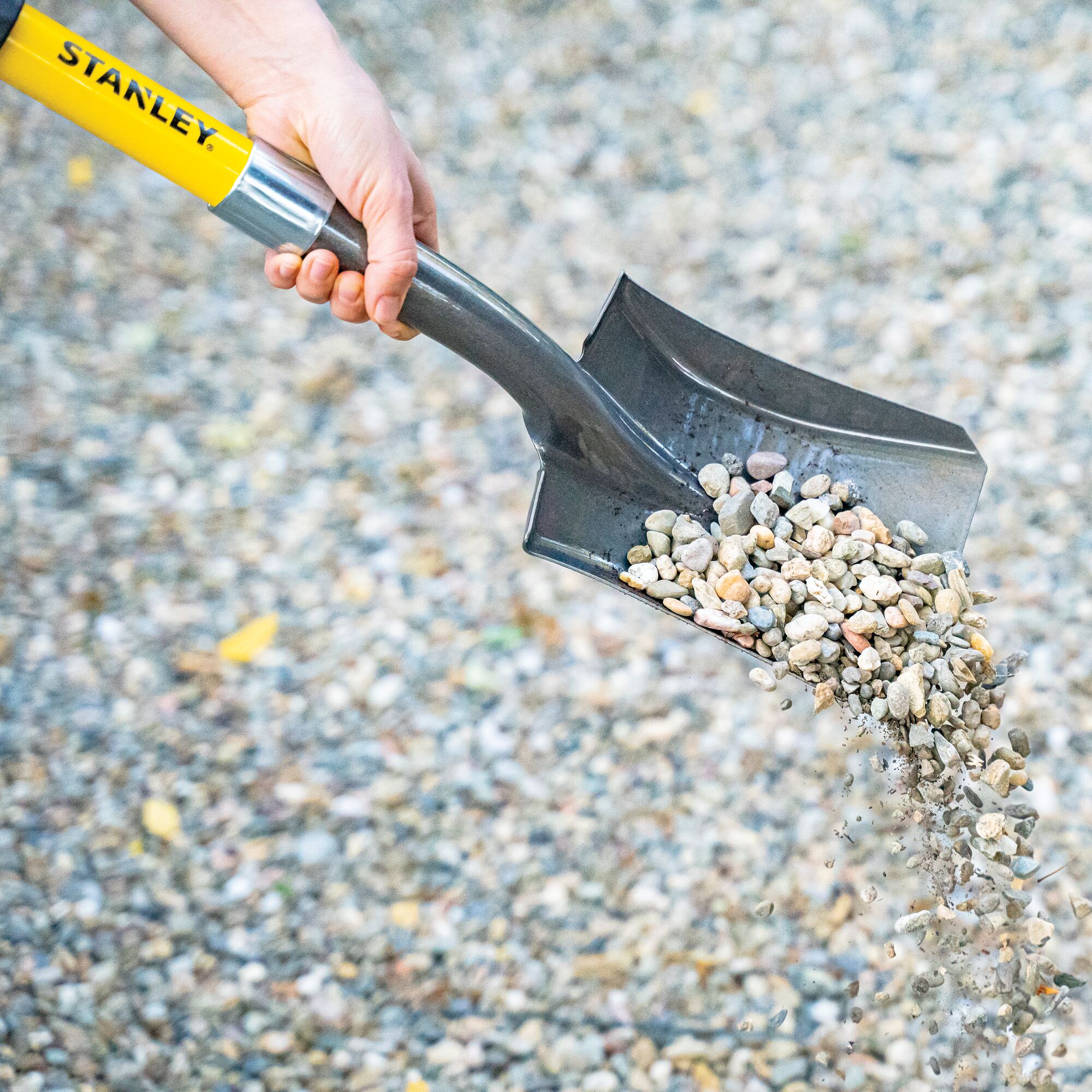 Mini D square head shovel holding granulated materials.
