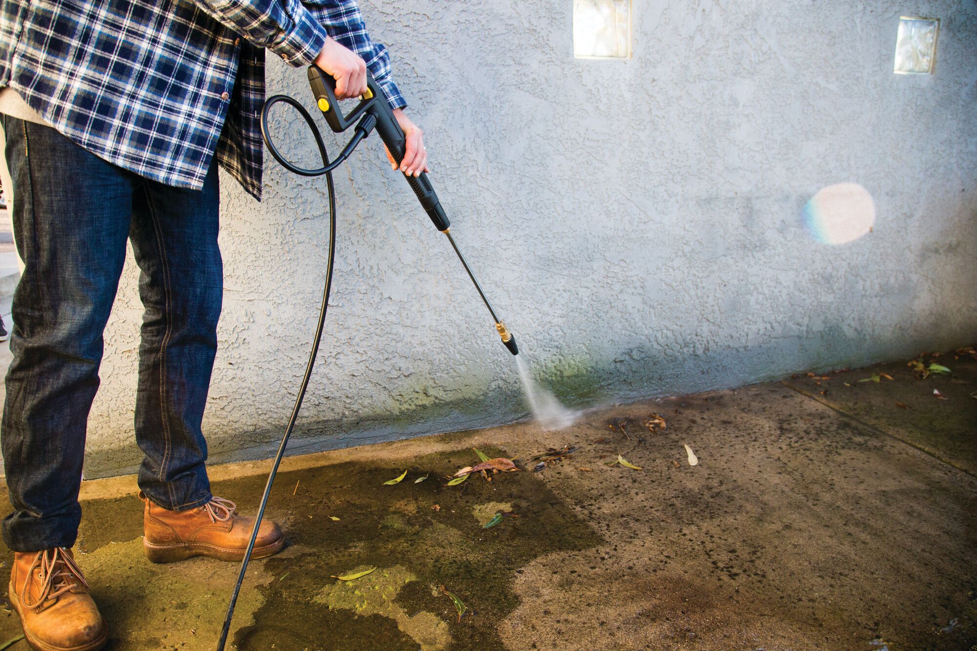 2150 P S I ELECTRIC PRESSURE WASHER being used to clean.