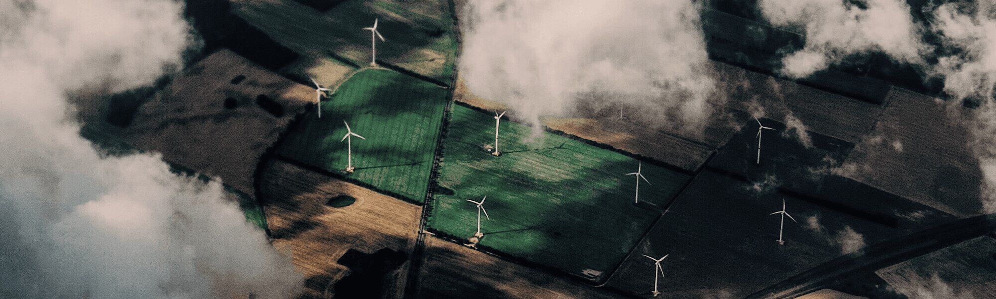 Field with wind turbine look from above.