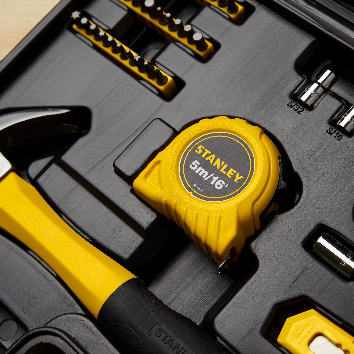 Close up of 65 piece Homeowner's Tool Kit featuring 16 foot Tape Rule.