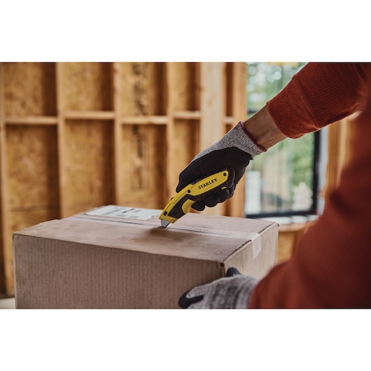 Retractable Utility Knife being used for opening packages.